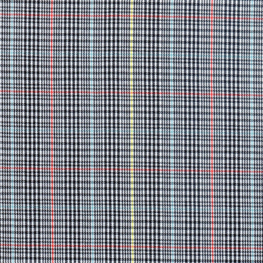 Tela de uniforme a rayas negras, rojas, amarillas y azules en un fondo blanco